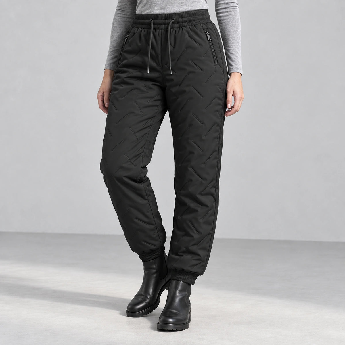 Women’s fleece-lined winter pants in black — front studio view