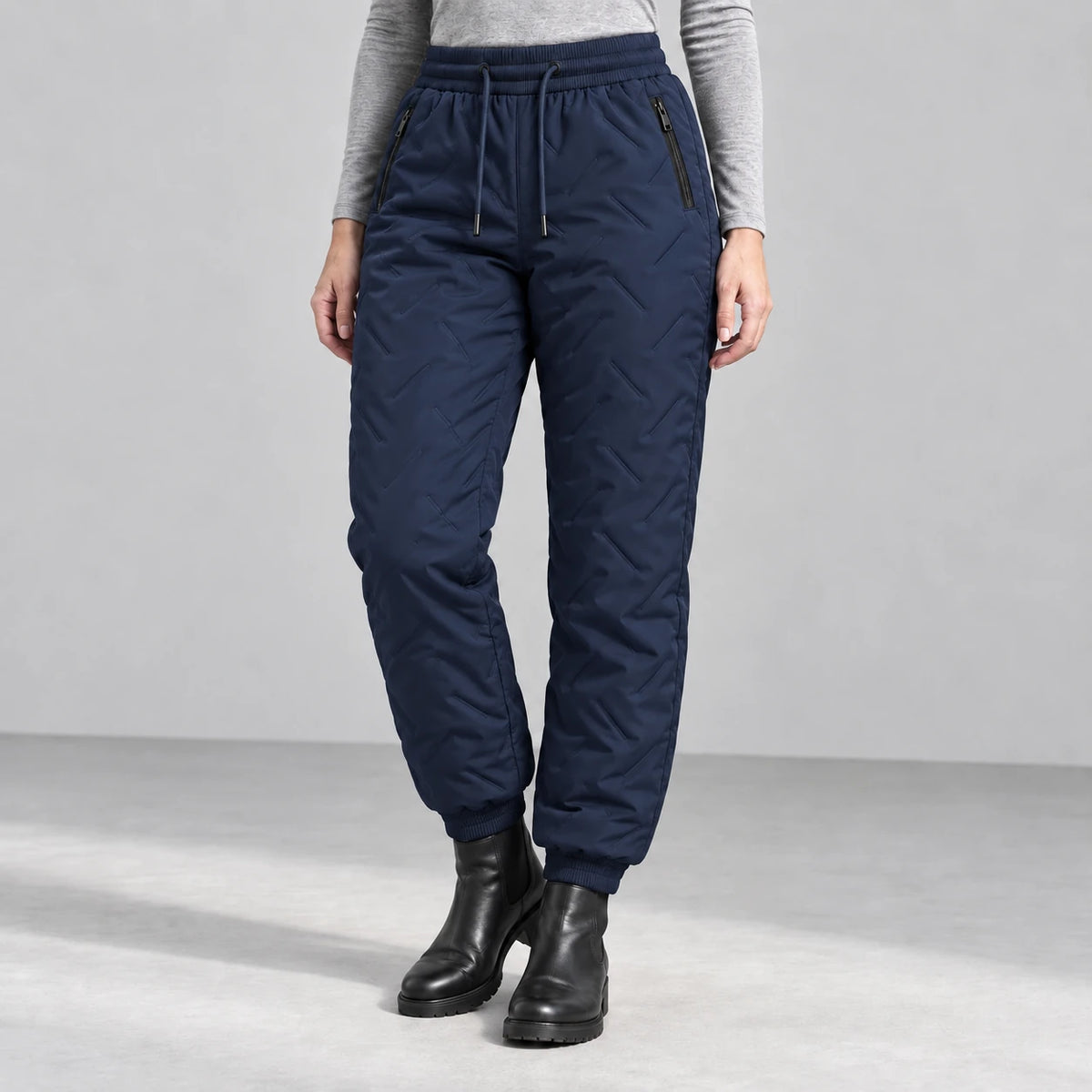 Women’s fleece-lined winter pants in navy — front studio view