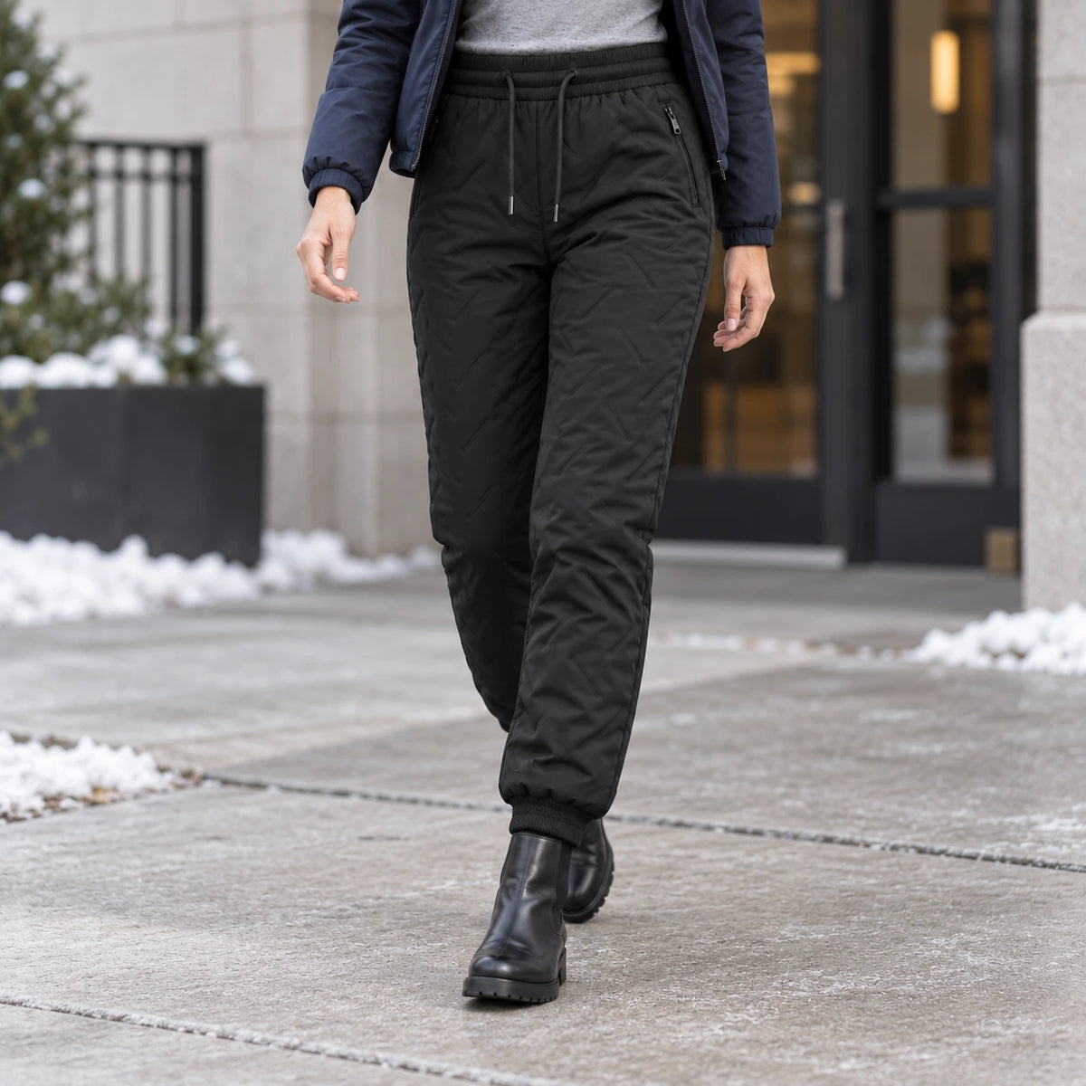 Women wearing black fleece-lined winter pants outdoors