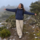 MW Haven — Navy fleece-lined jacket worn on a snowy mountain trail