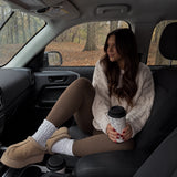 Luma caramel fleece-lined tights styled in a parked car on a rainy day