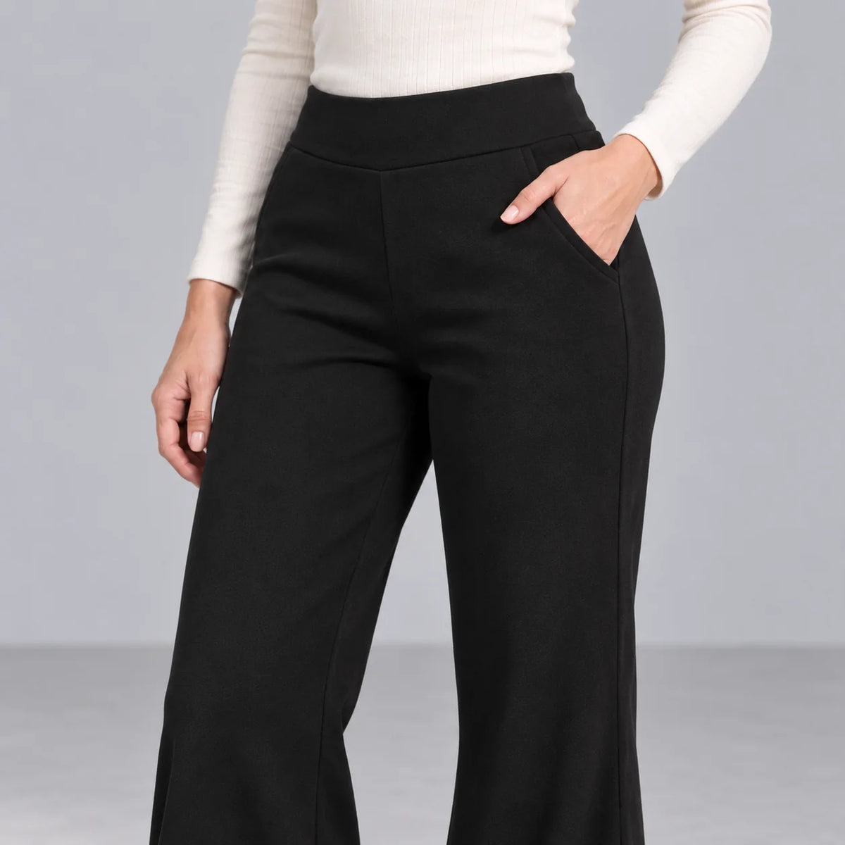 Mira black fleece-lined bootcut pants — high waist and side pocket detail