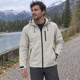 Ridge Shell Jacket in Stone worn beside a mountain lake